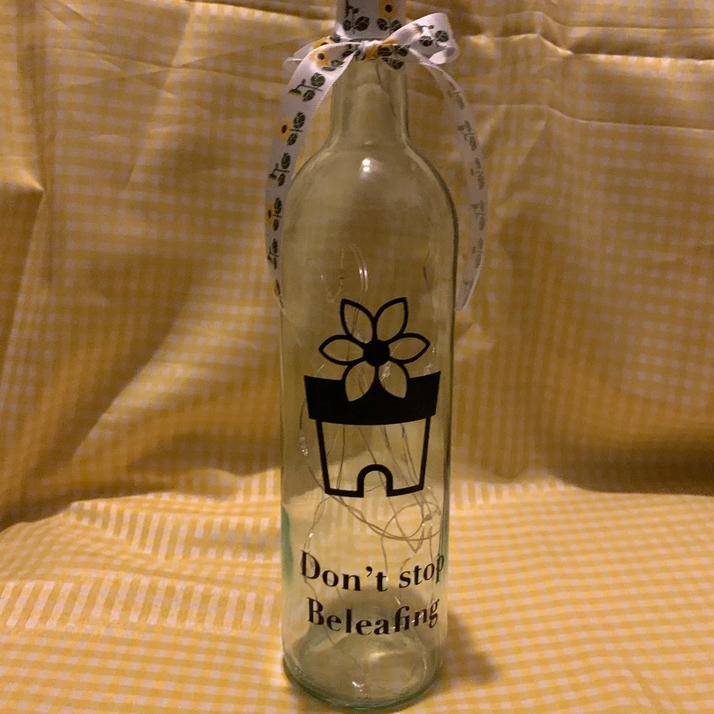 ‘Don’t Stop Beleafing’ logo wine bottle lantern